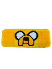 Adventure Time dizisinin sevilen karakteri Jake the Dog figürlü, canlı sarı renkte ve yumuşak akrilik iplerle el yapımı olarak dokunmuş, oyuncu masalarına konfor ve şıklık katan dekoratif tufting klavye pedi.